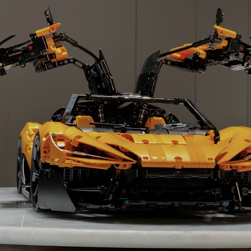 Orange MOC 03 front three-quarter view with both gullwing doors raised